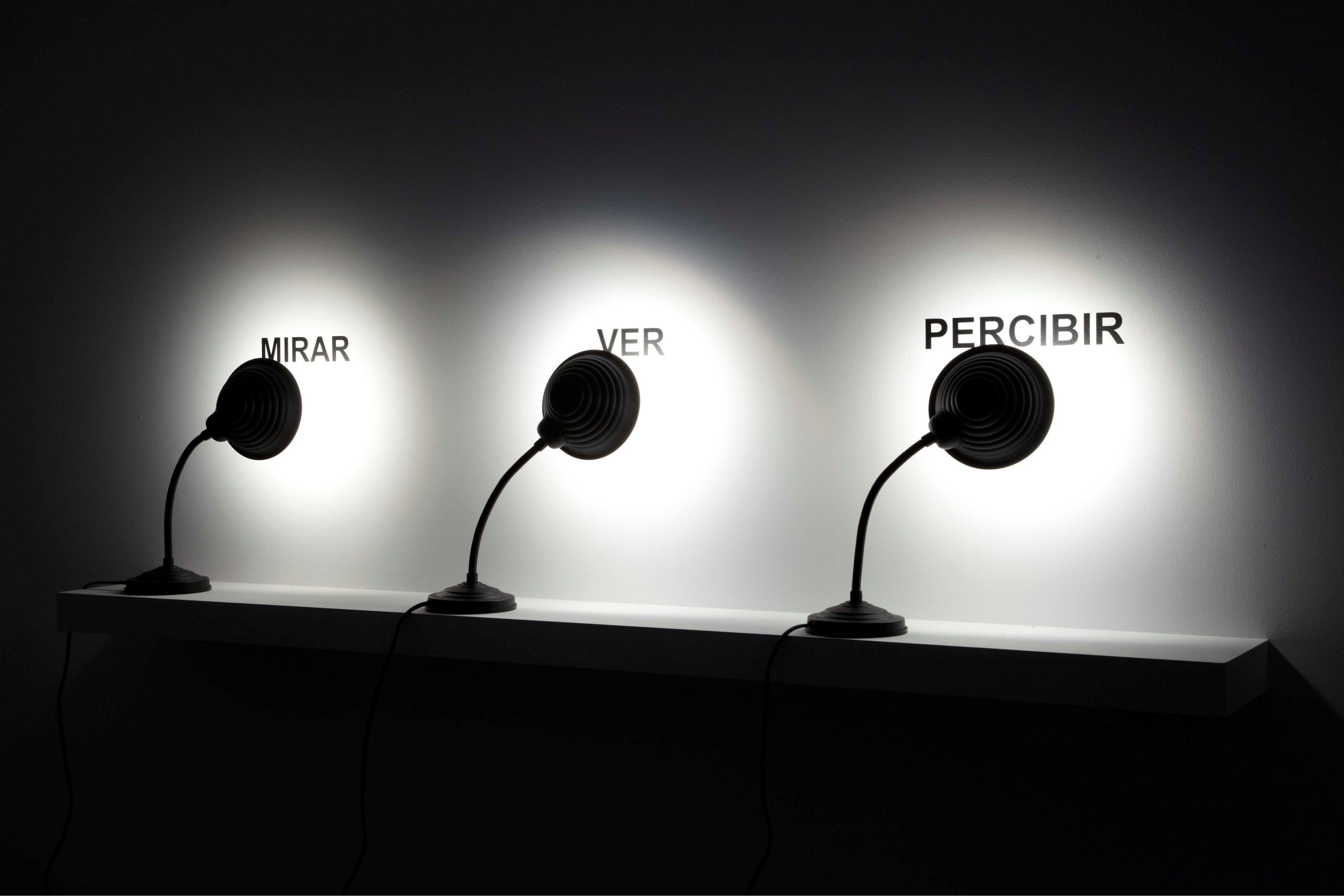 Antoni Muntadas Look See Perceive, 2009, Installation Desk lamps, cut vinyl graphics, white shelve, Edition 6 +2AP, USD 10,001 – 25,000 @ Vanguard Gallery